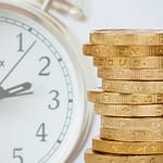 prodej zlata - na obrázku zlaté mince a hodiny